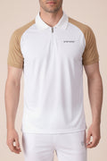 White polo shirt with brown sleeves worn by a person on a beige background